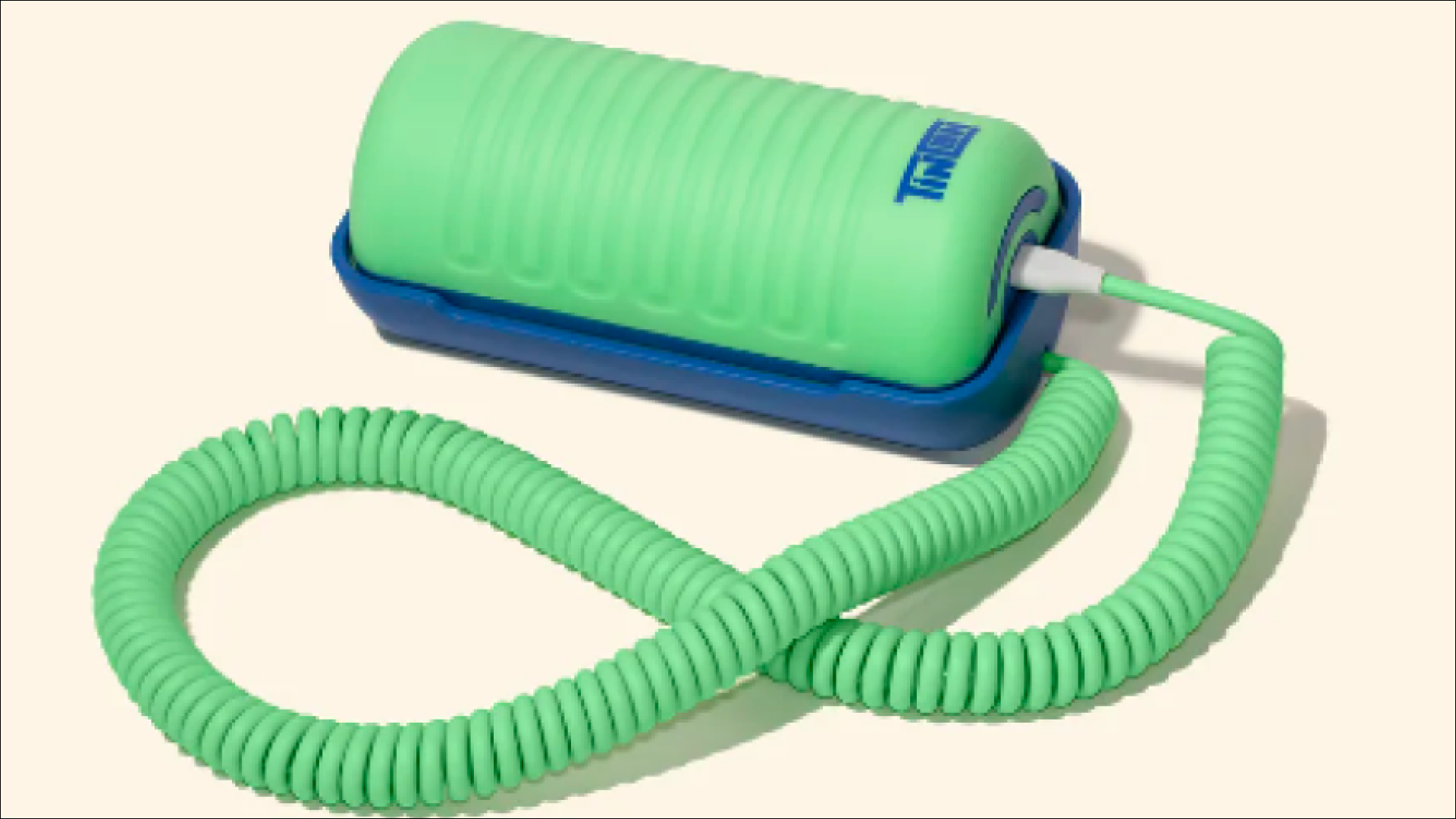 Green Tin Can kids phone with coiled cord on a blue cradle, a US children's phone product